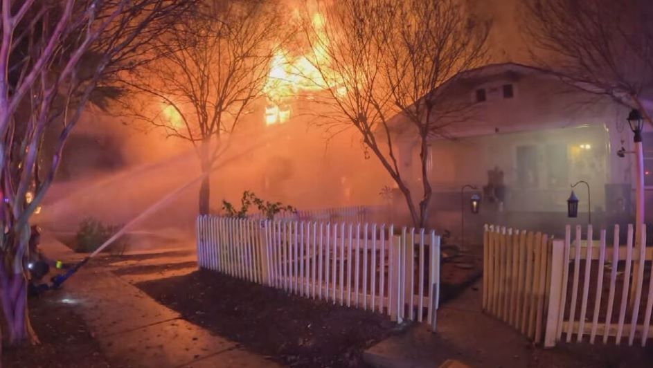 a house with a fire in the background